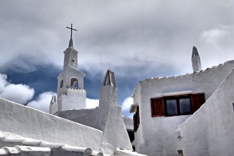 Whitewashed buildings in the old town of Es Mercadel
